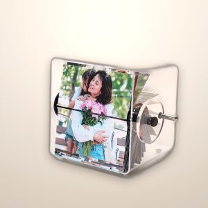 Clear acrylic flip photo album with a hand crank