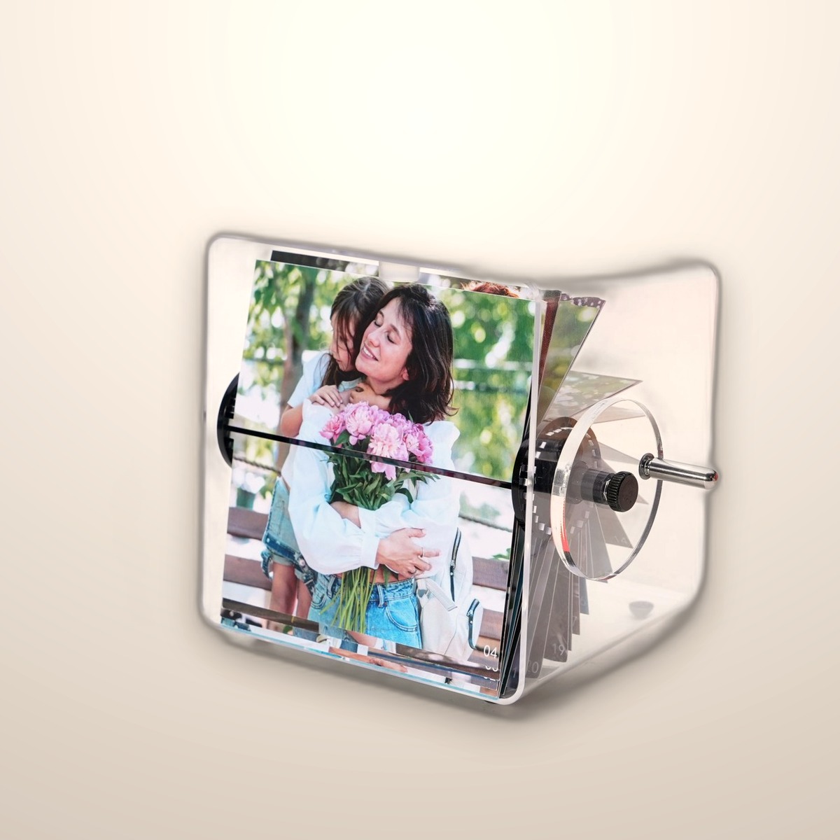Clear acrylic flip photo album with a hand crank