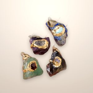 Raw crystal pendant on a gold-tone setting